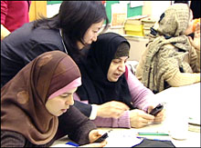 Students at the Mennonite Centre for Newcomers are testing mobile learning - downloading an English grammar lesson, then answering a series of multiple choice, or true or false questions.